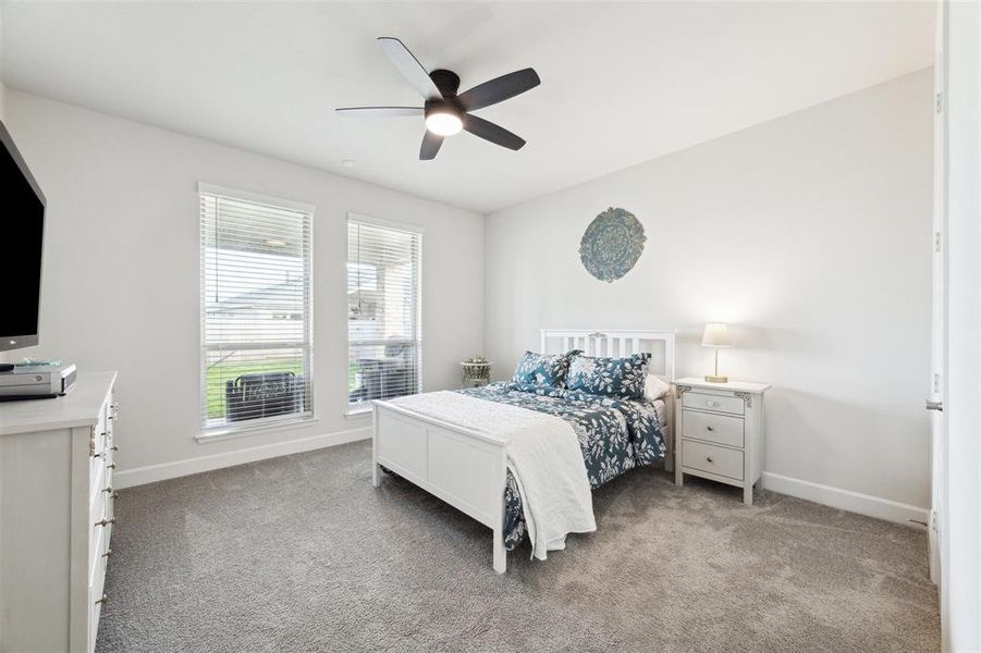 Bedroom #2 is on the lower level and is located at the rear of the property. Double windows provide a view into the covered patio and backyard.