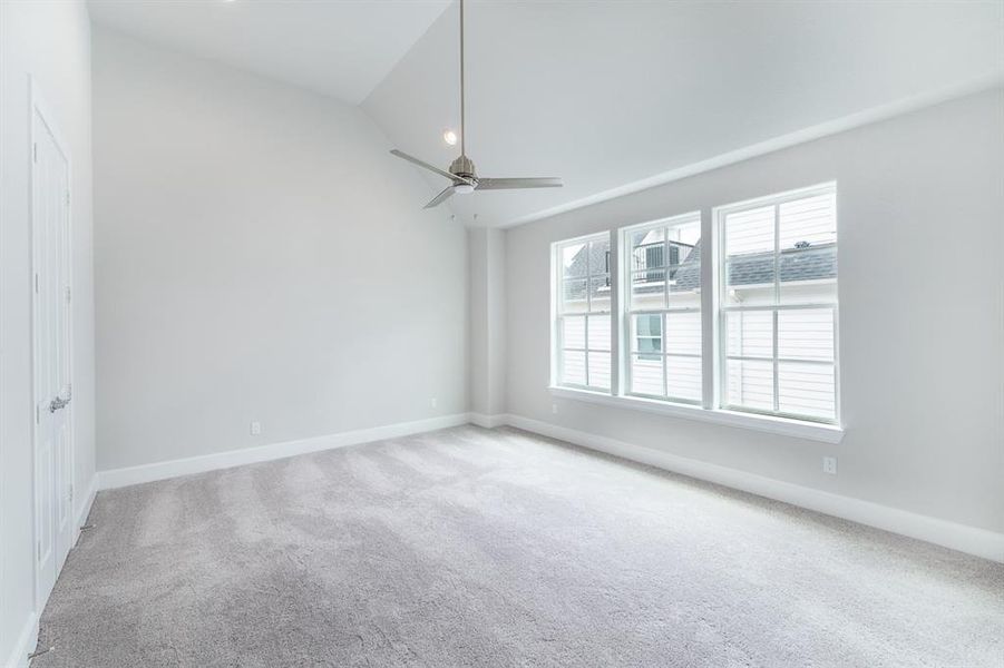 Giant Primary bedroom with 3 large windows and 2 huge closets.