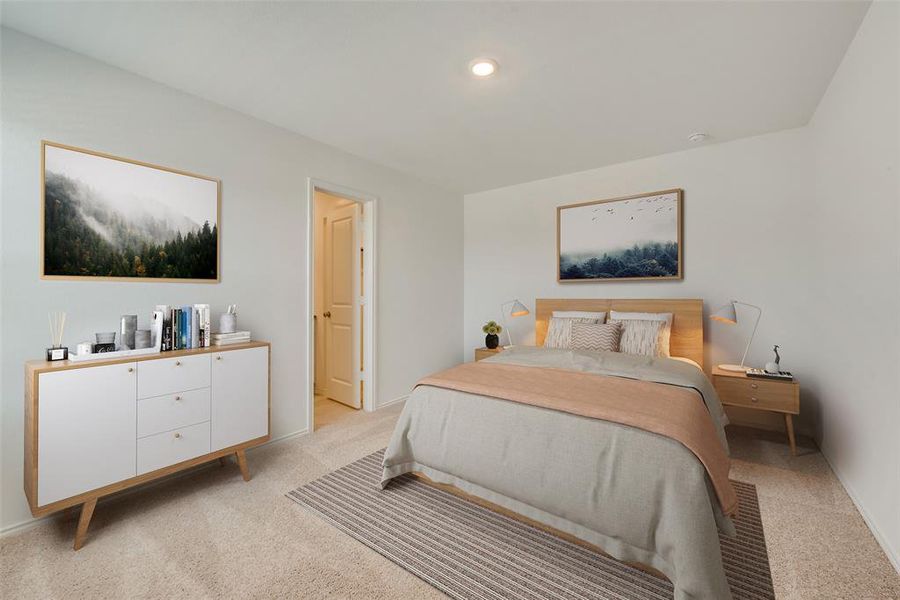 Bedroom featuring light colored carpet