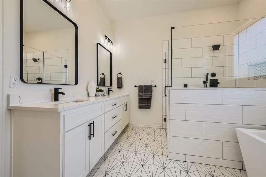 Bathroom with plus walk in shower, tile patterned flooring, and vanity