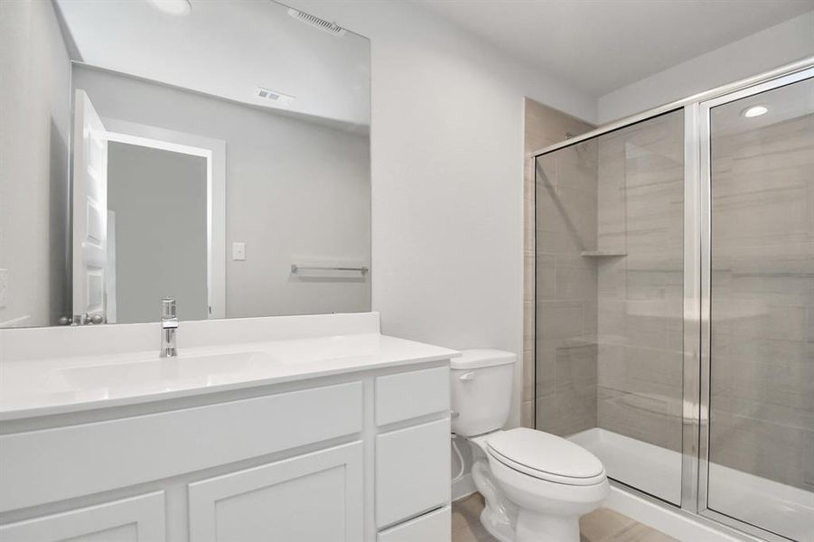 Guest suite bath with walk in shower. Sample photo, actual color and selections can vary.
