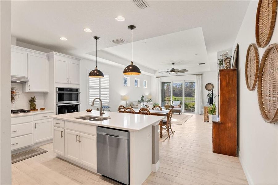 Kitchen opens to great room.