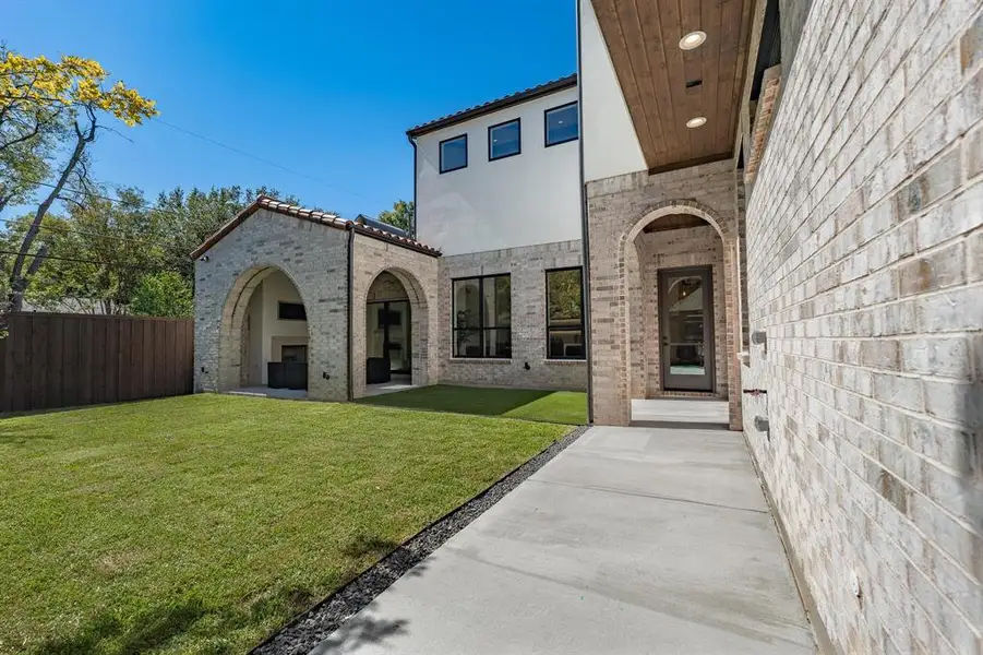 Entrance to property featuring a lawn