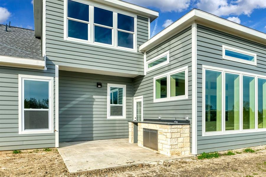 Rear view of house with a patio area