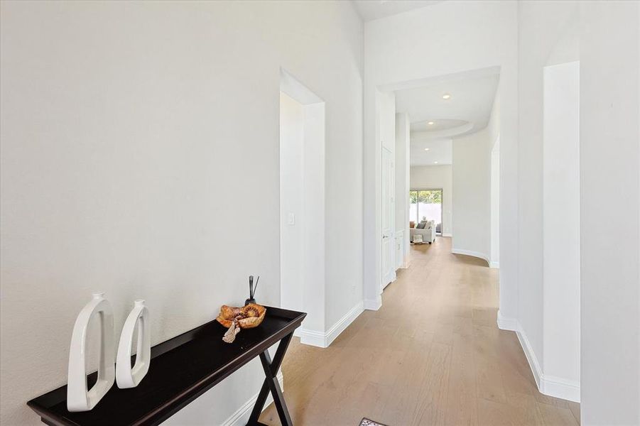 Corridor with light hardwood / wood-style floors