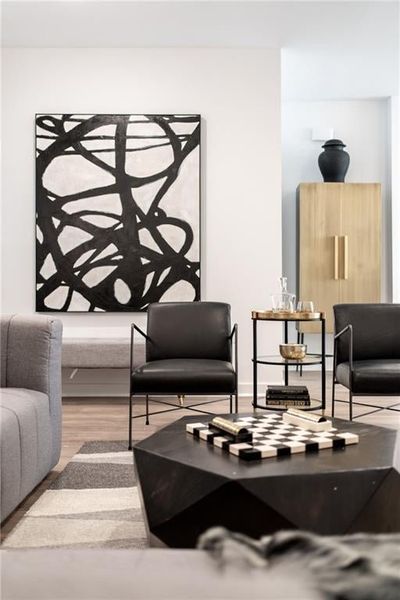 Living room with hardwood / wood-style flooring and ceiling fan