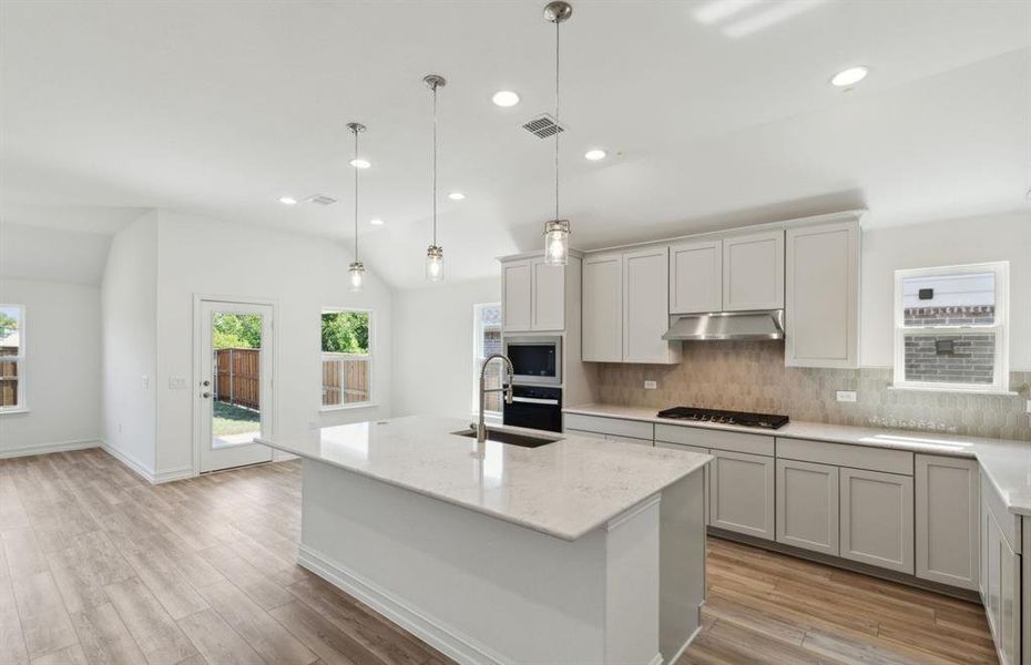 Bright kitchen with ample cabinet space *real home pictured