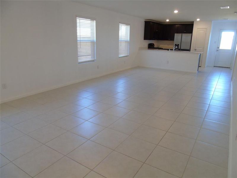 Unfurnished living room with light tile patterned flooring