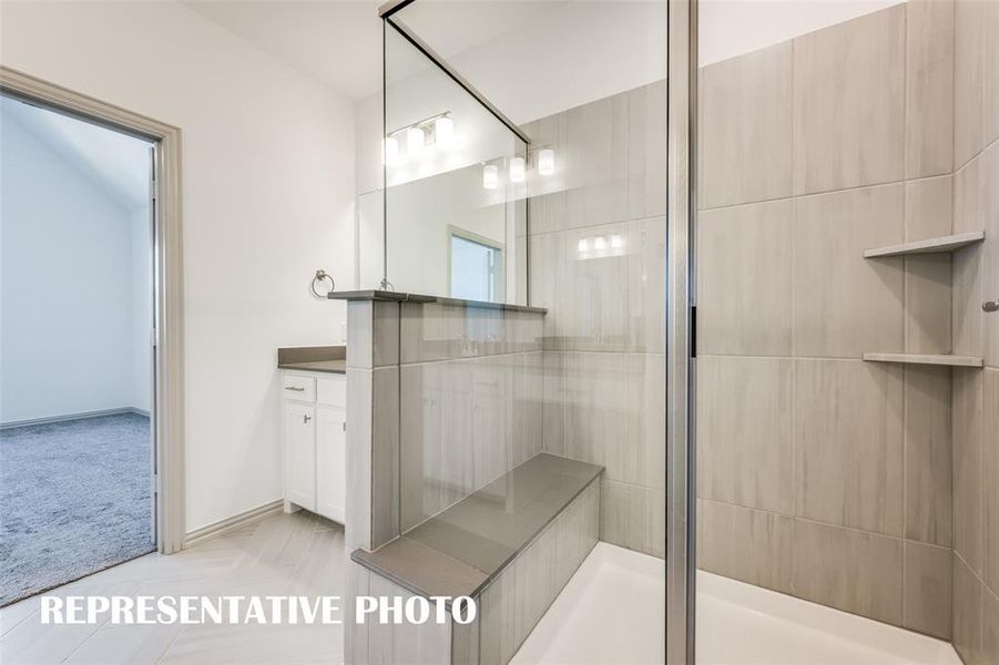 Your new oversized, walk in shower complete with built in seat is the perfect place to start or end your day.  REPRESENTATIVE PHOTO.