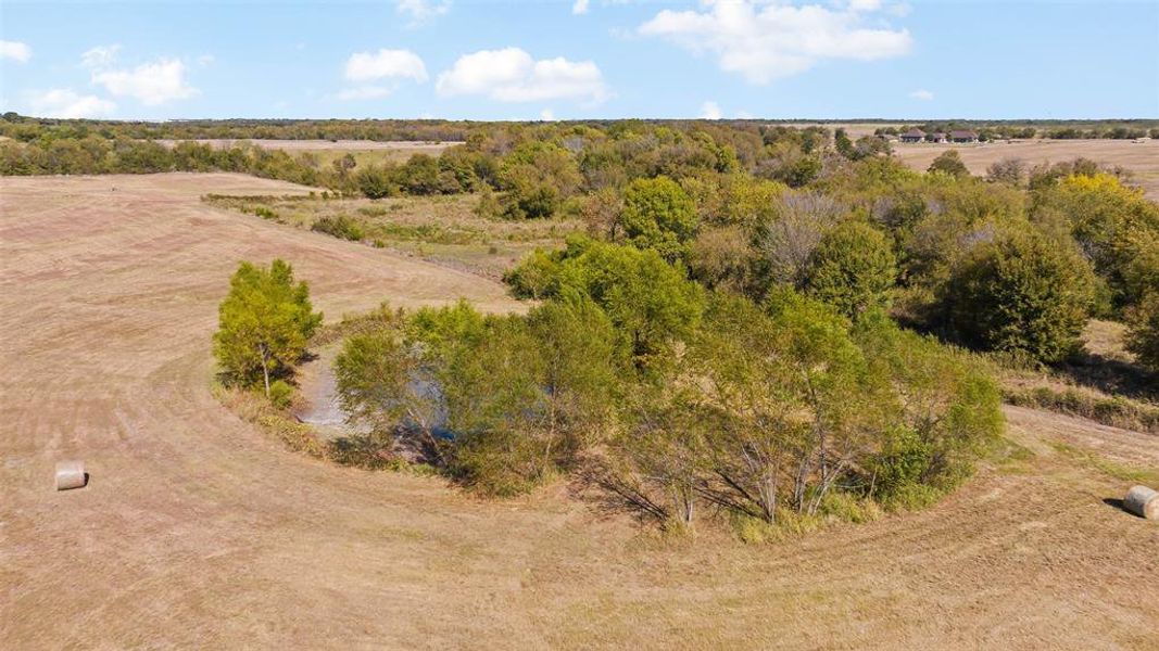 Birds eye view of property featuring a rural view