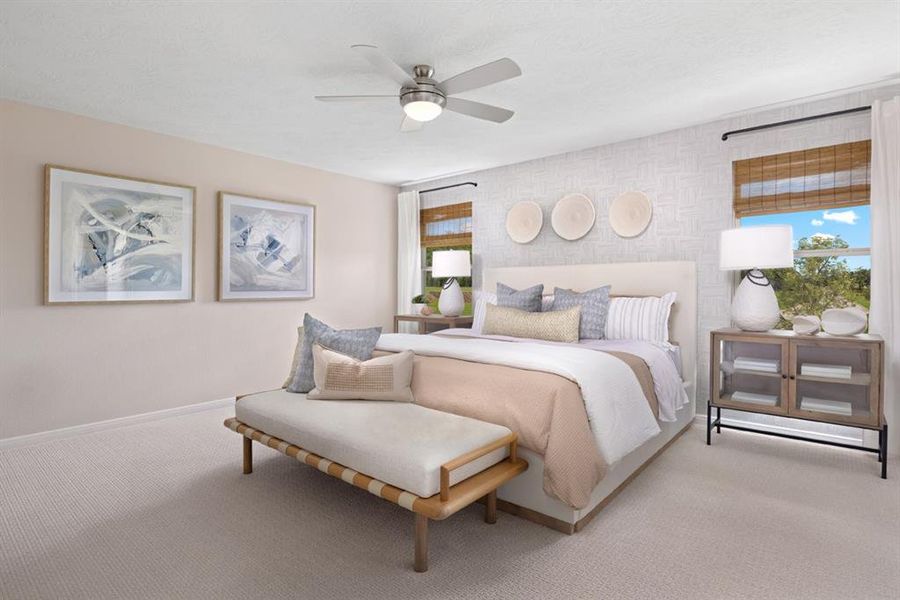 Come and unwind after a long day in this magnificent primary suite! This spacious room features plush carpet, warm paint, high ceilings with ceiling fan and lighting, and large windows with privacy blinds.