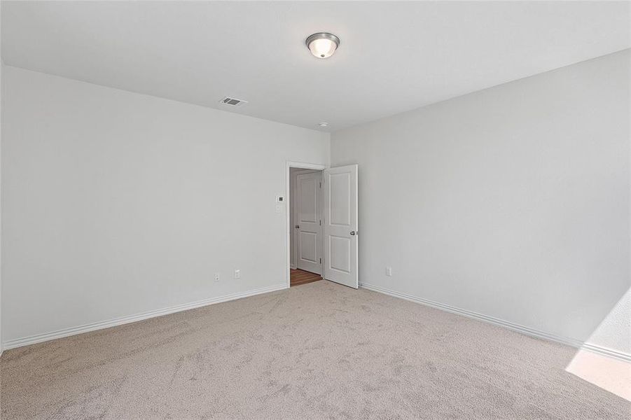 Unfurnished room with carpet