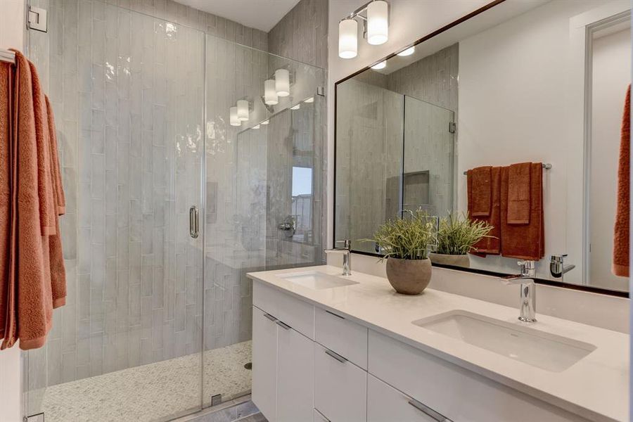 Master Bathroom with frameless walk-in shower. *Model Home*