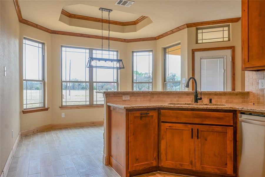 Spacious dining room with lots of windows.