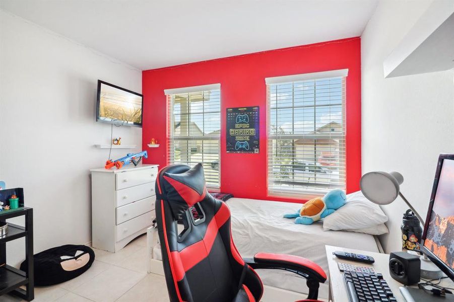 Bedroom with light tile patterned floors