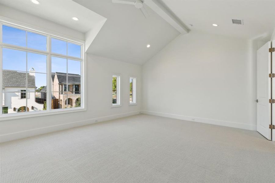 Game room with ceiling fan, beamed ceiling, and high vaulted ceiling