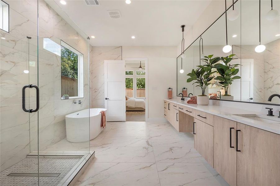 Bathroom featuring tile patterned flooring, tile walls, double sink vanity, and an enclosed shower