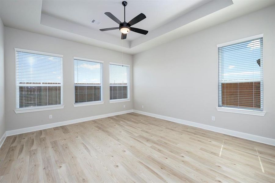 Enjoy the primary retreat with high ceilings, ceiling fans and coffered ceilings with an ensuite bathroom.