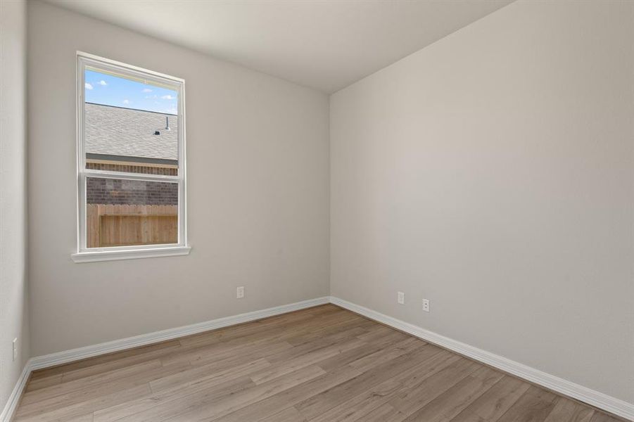 The home office features beautiful floors, large windows that give a fresh feel, this space promotes focus and creativity.