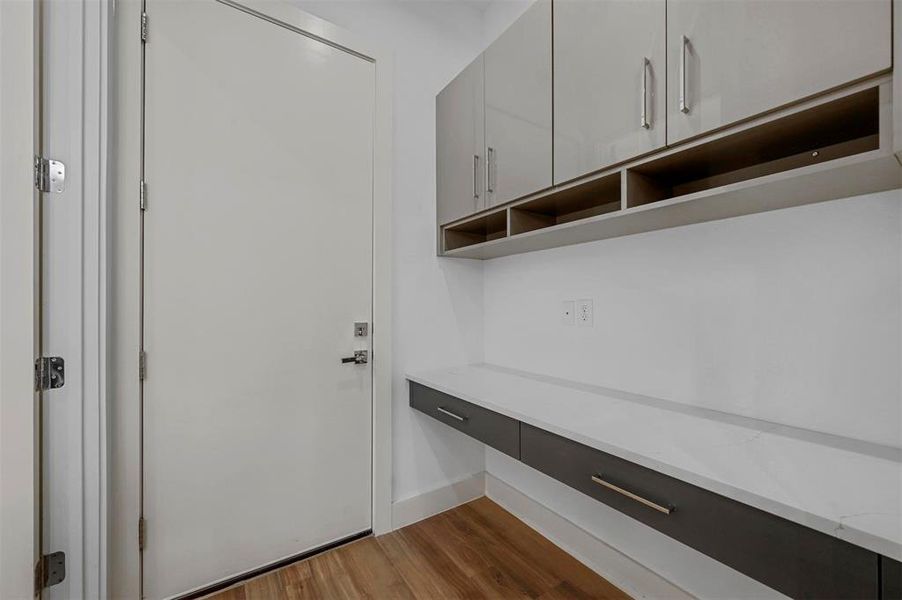 Mudroom with dark hardwood / wood-style floors