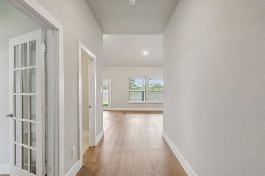 Corridor featuring light hardwood / wood-style flooring