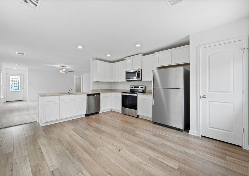 Enjoy cooking in a kitchen filled with stainless steel appliances and granite countertops