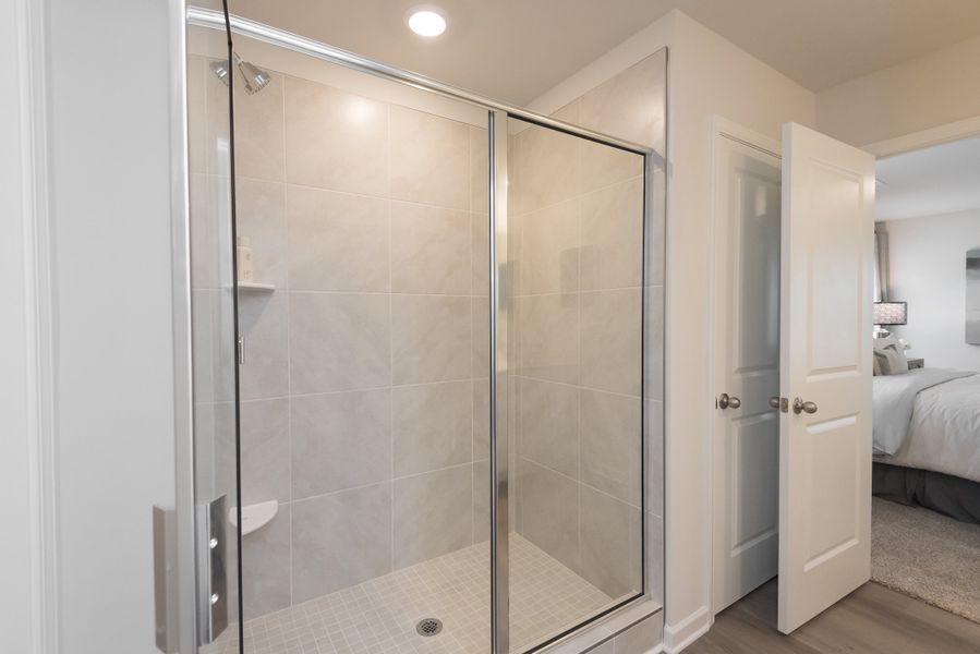 Enjoy a nice, warm shower after a long day in the luxurious primary walk-in shower.