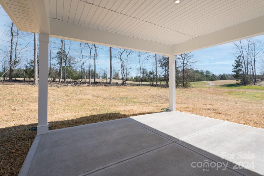 Optional Covered Patio (Deck with stairs on crawlspace homes). Photo representation. Colors and options will differ.