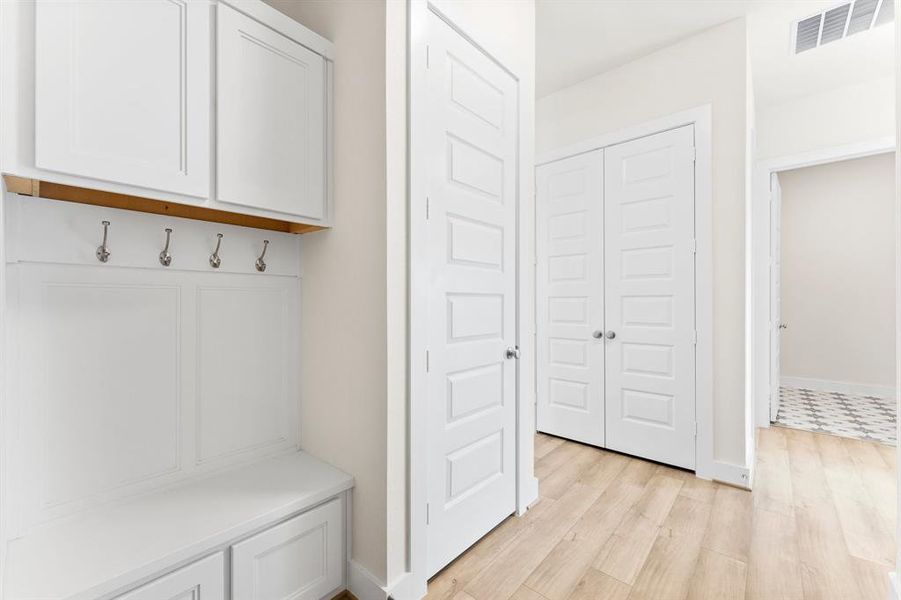 Built-in Mud Bench, Coat Closet, and Linen Closet