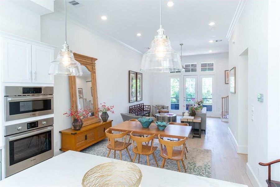 Loft style with transom windows above the French doors leading balcony (Similar plan and finishes, actual home has windows down the side, end unit)