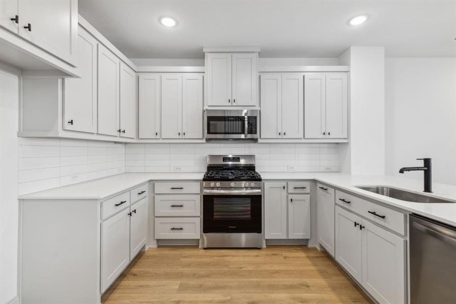 This thoughtfully designed kitchen offers plenty of storage and prep space!