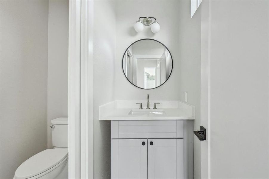 The guest bathroom is a stylish sanctuary featuring modern fixtures and tasteful finishes, providing a welcoming space for visitors to freshen up and unwind.