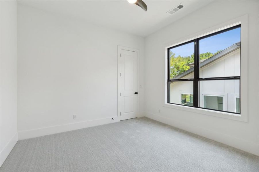 Second of 3 secondary bedrooms upstairs. All with their own private baths.