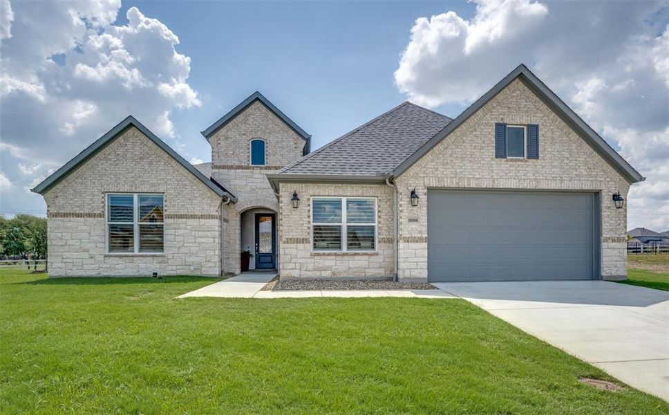 Front of home showing brick and stone