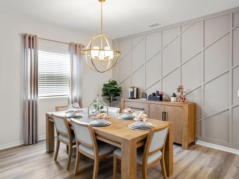 The designated dining area is the perfect spot for family dinners or hosting friends - Summerlyn ll home plan by Highland Homes