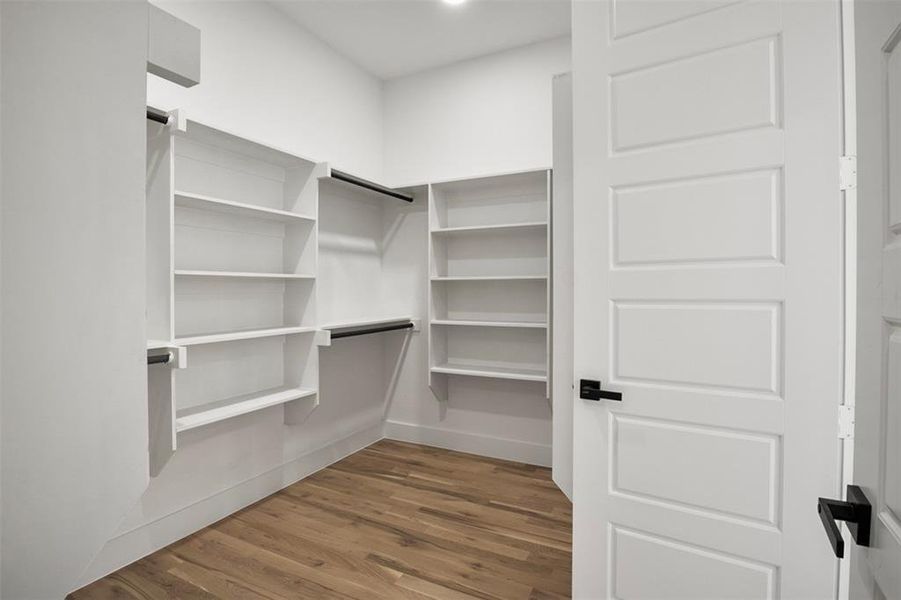 Walk in closet featuring hardwood / wood-style flooring