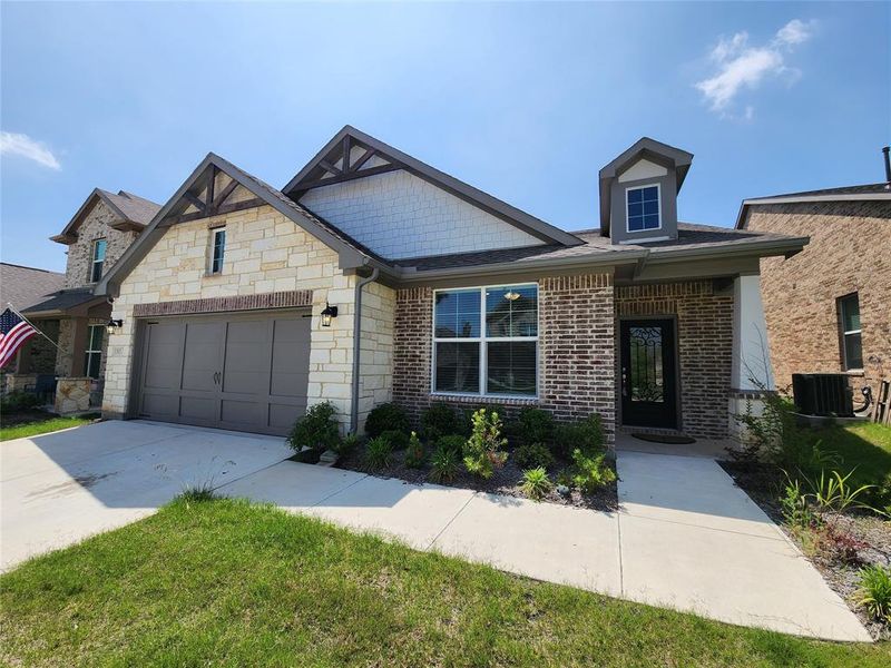 View of front facade with a garage.