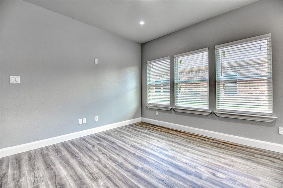 Spare room with hardwood / wood-style floors