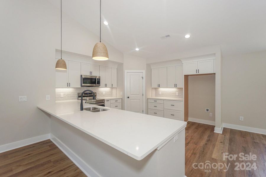 (Representative photo) The kitchen will feature a large breakfast bar for casual meals and the pendant lighting.