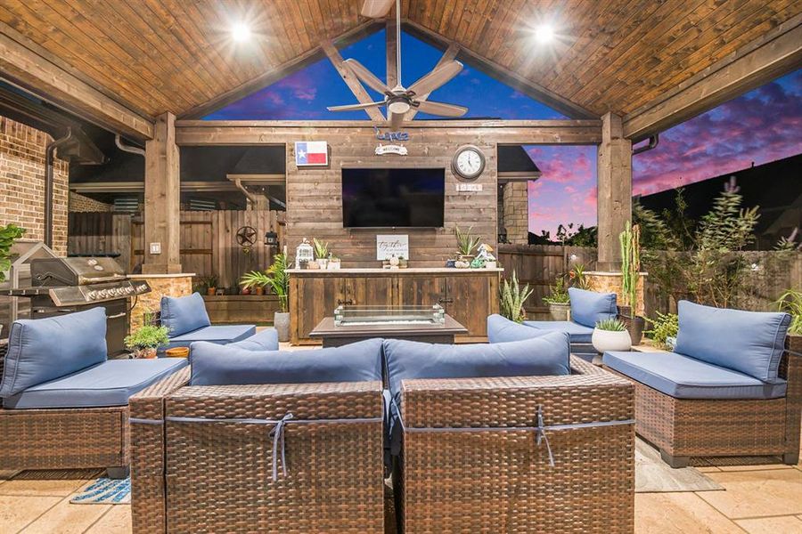 Cedar patio with tongue-and-groove ceiling, recessed lighting, ceiling fans, and a storage area