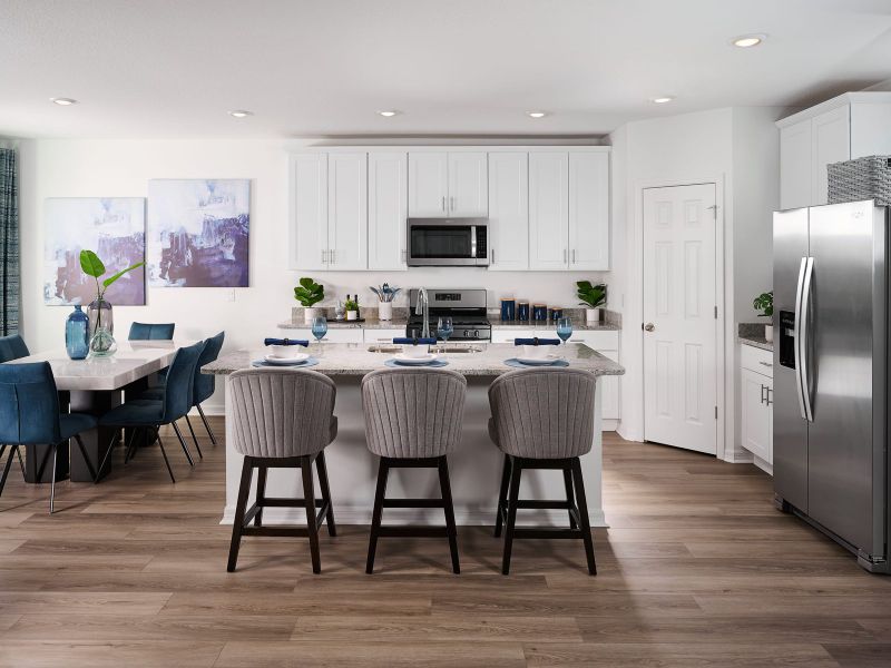 Kitchen in the Hibiscus floorplan modeled at The Reserve at Twin Lakes