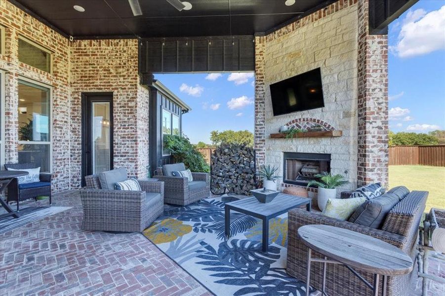 View of patio / terrace featuring an outdoor living space with a fireplace