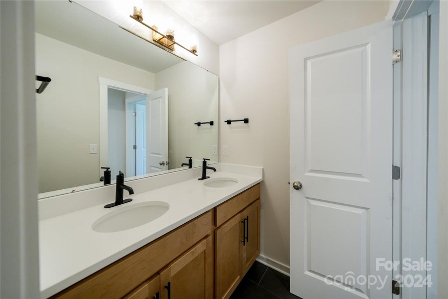 Secondary Bathroom with dual sinks