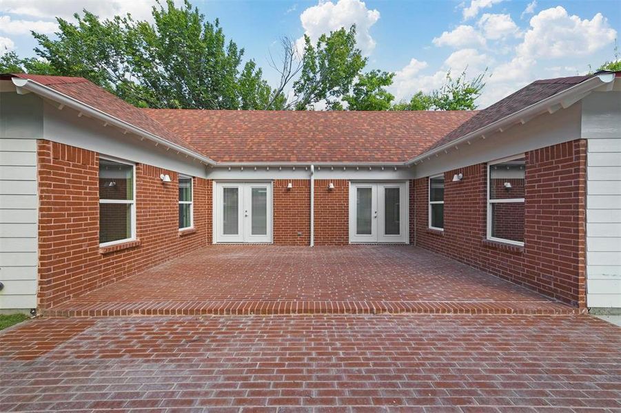 Rear view of property with french doors and a patio area