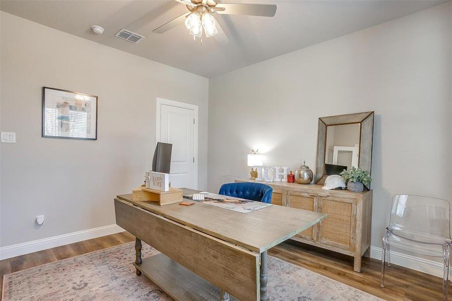 Office area featuring ceiling fan and light hardwood / wood-style flooring