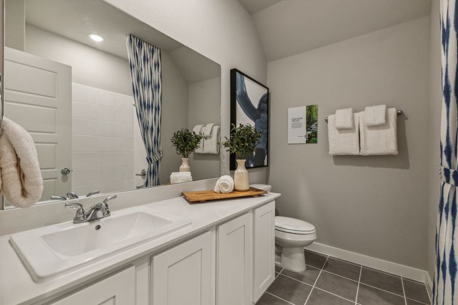 Bathroom in the Stanley II home plan by Trophy Signature Homes – REPRESENTATIVE PHOTO