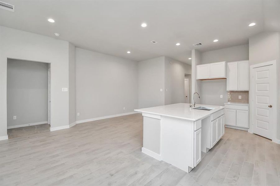 Dinning area connected to the kitchen for convenience. Sample photo of similar plan. As-built color and selections may vary.