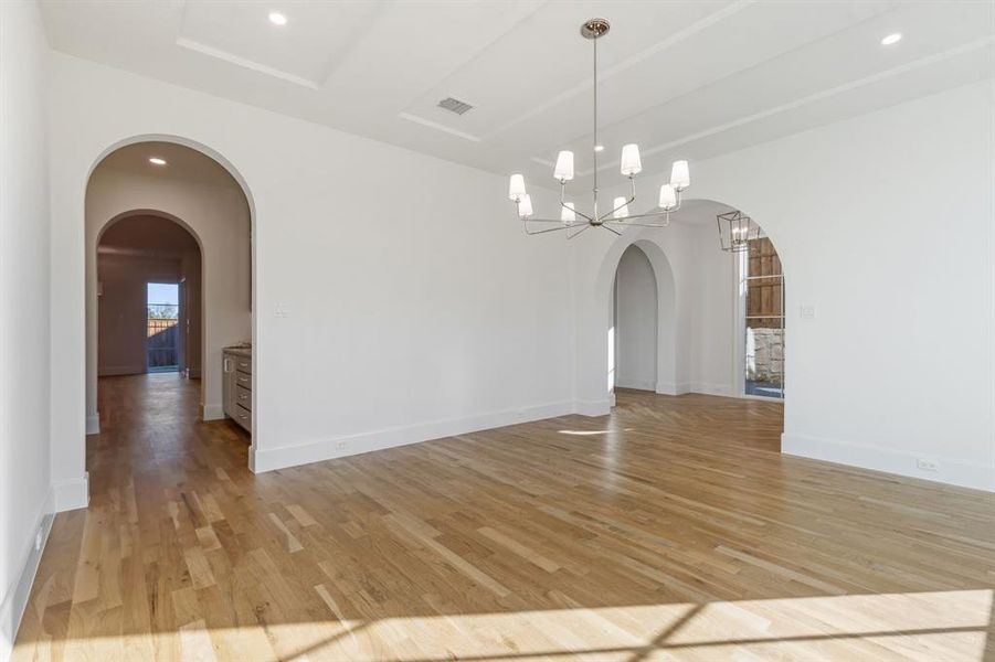 Dining area featuring a chandelier and light hardwood / wood-style flooring