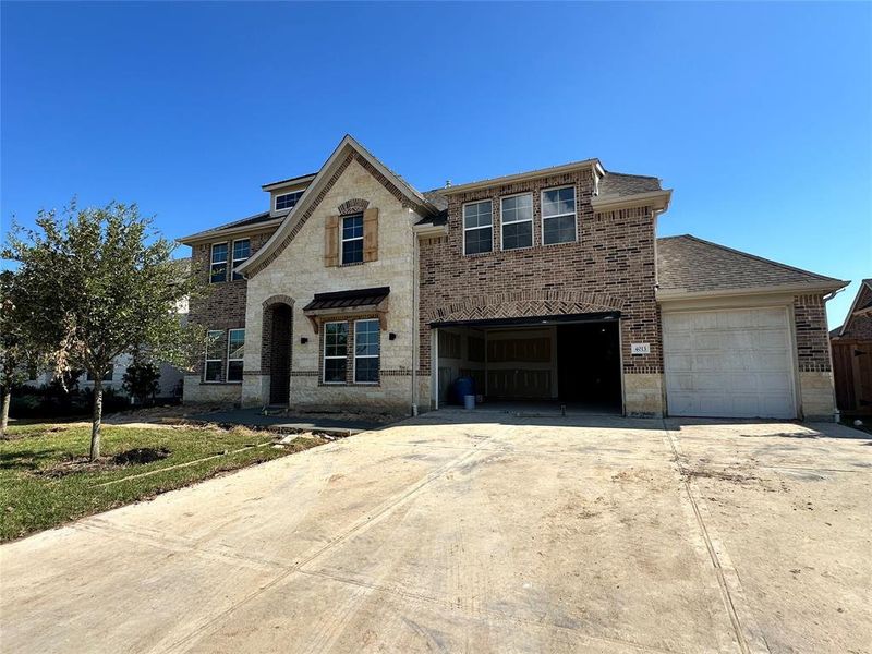 Two-story home with 4 bedrooms, 3.5 baths and 4 car tandem garage