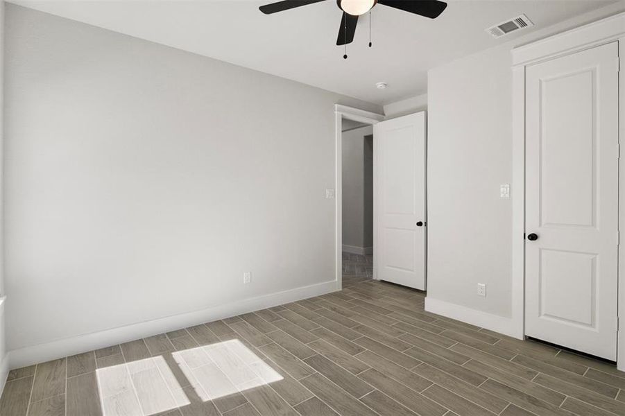 Unfurnished bedroom featuring ceiling fan